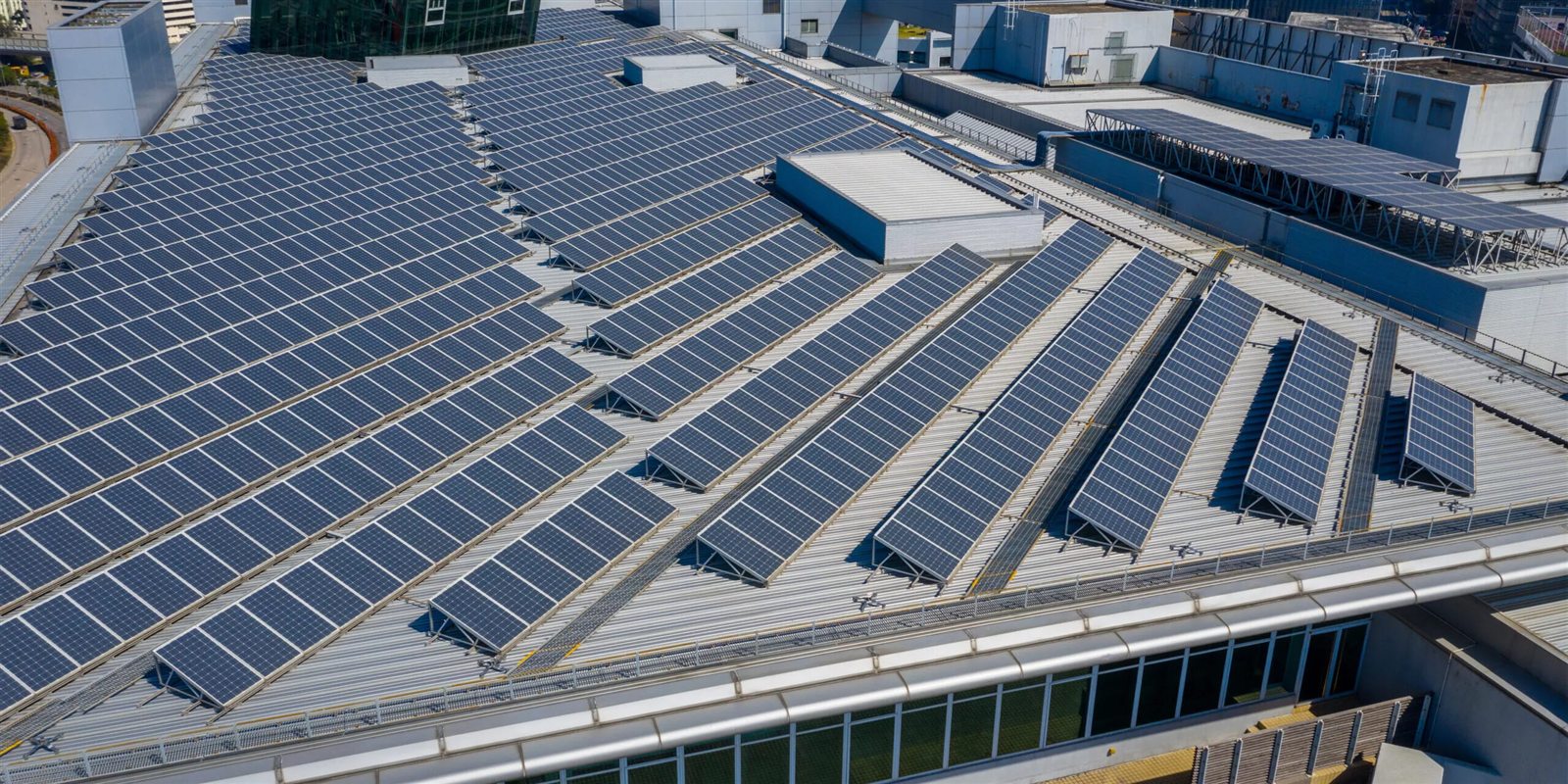 Large commercial rooftop covered with solar arrays